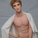 Men's Hot Sex Doll - Holding Sex Doll Penis with nice abs.